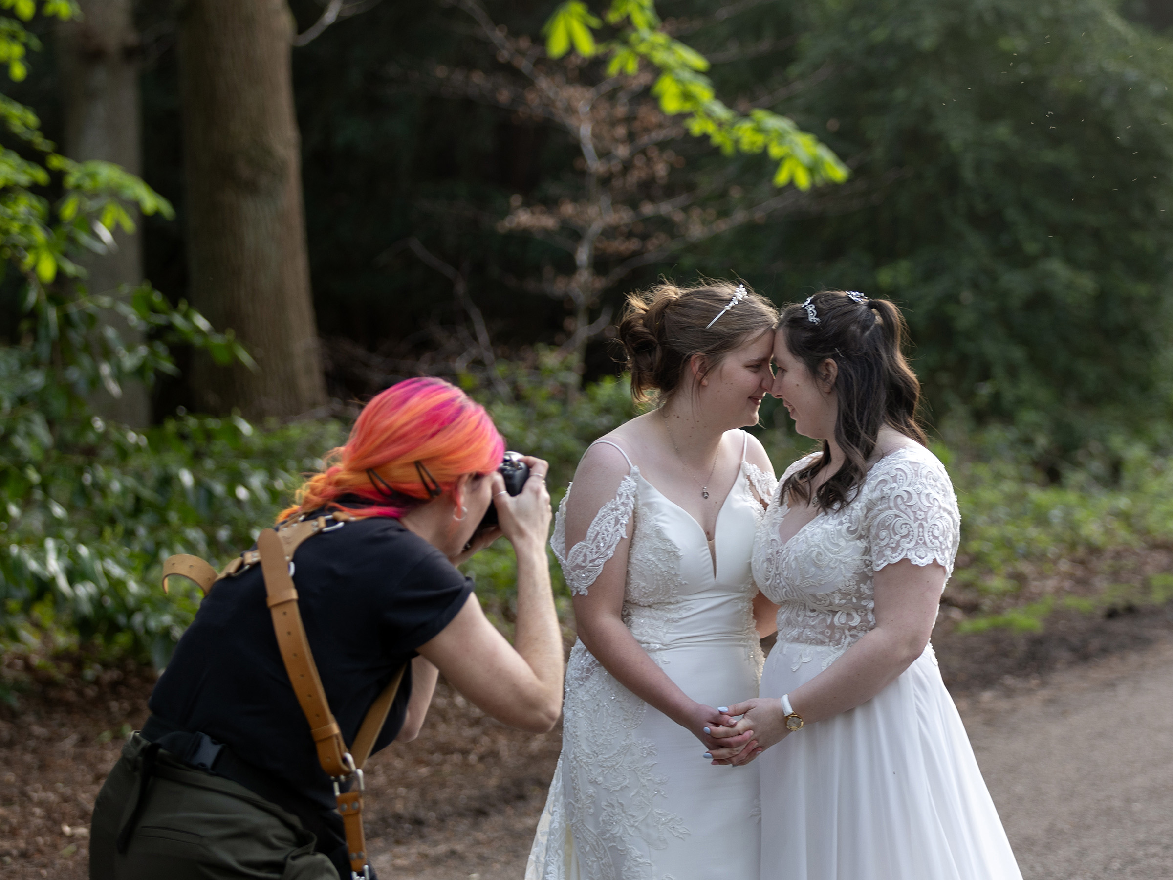 Frankie of Pink Photographics, Lincolnshire wedding Photographer taking a photo of 2 brides at a recent wedding
