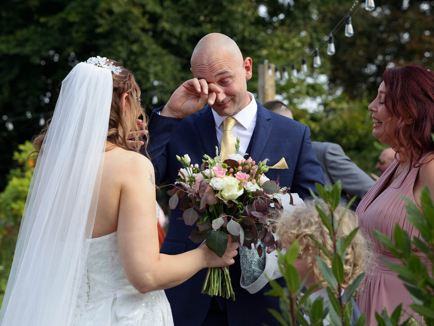 Cockliffe wedding. A Bride is talking to her brother who is wiping a tear from his eyes