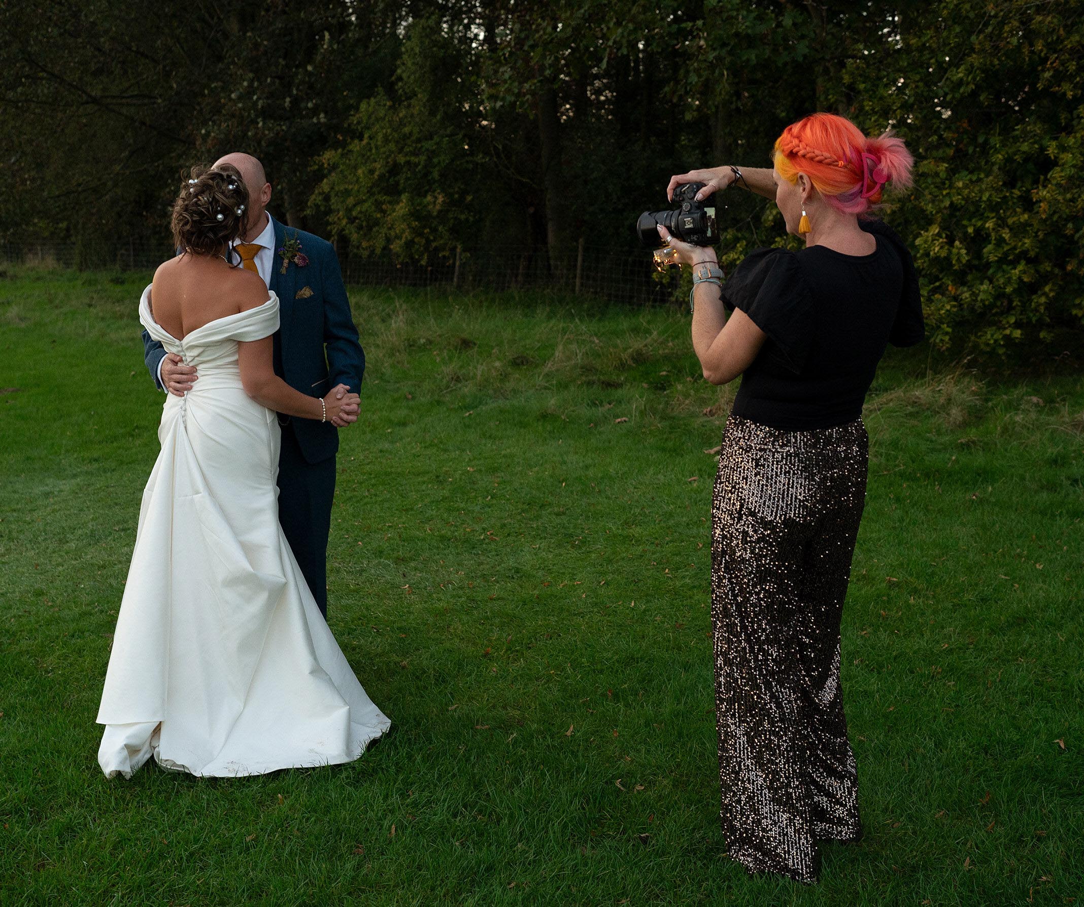 Lincolnshire Wedding Photographer Pink Photographics is taking photos of a Bride and groom at Scrivelsby Walled Gardens